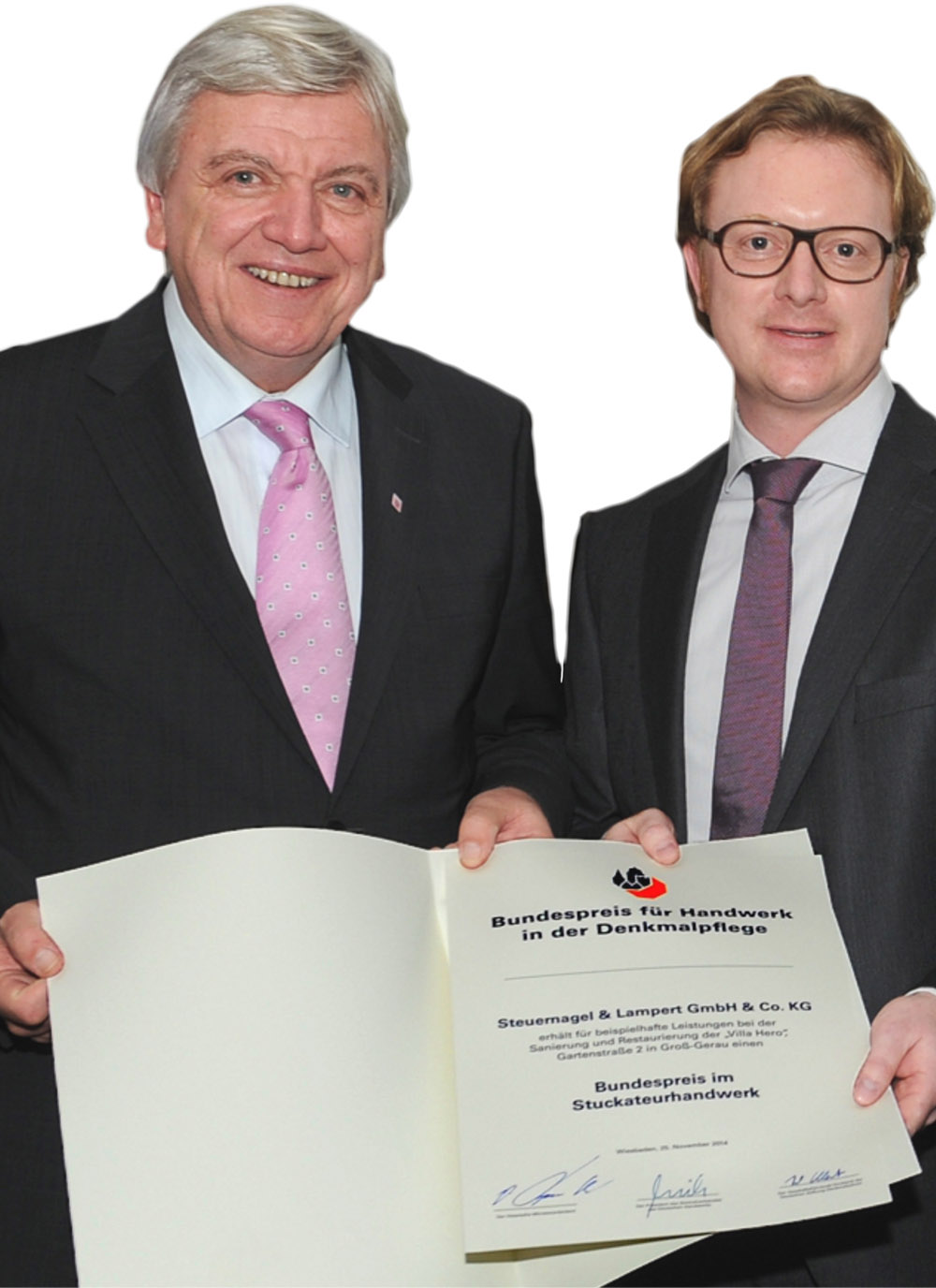 Bei der Ehrung Ende 2014 in Wiesbaden: Hessens Ministerpräsident Volker Bouffier (links) und Malermeister Jörg Held