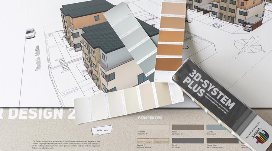 Technische Zeichnung eines Gebäudes, darauf liegt ein ausgebreiteter Farbfächer 