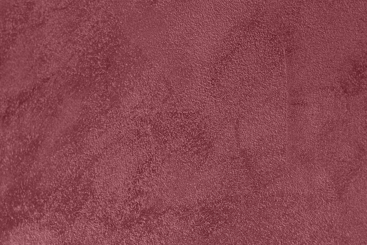 Ein Textur-Hintergrund in einem tiefen Rotton und leicht unregelmäßigen Mustern.